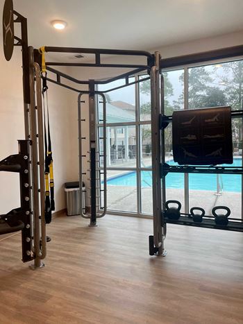 24-Hour fitness center with trx, free weights, and cardio equipment